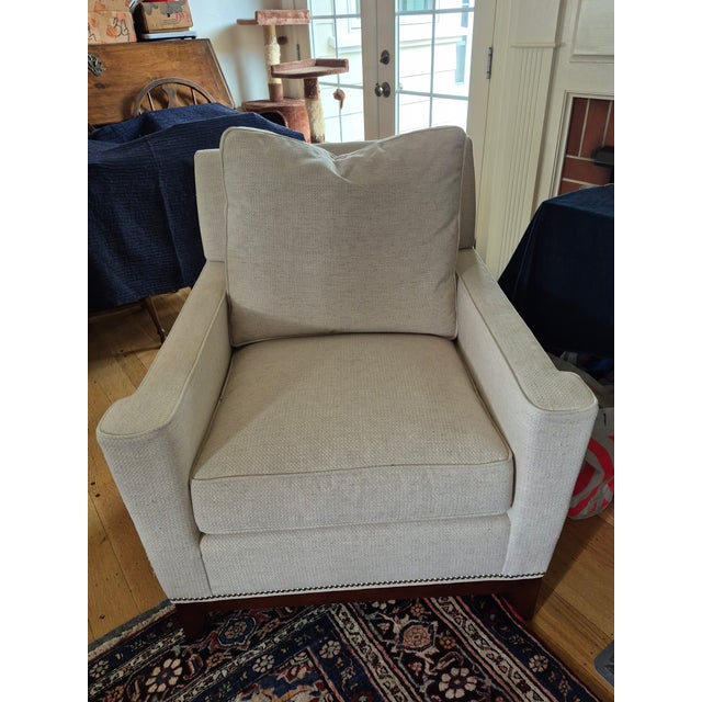 This Stickley "Haven" armchair in off-white with nailhead trim was recently purchased with a matching sofa. Sadly it...