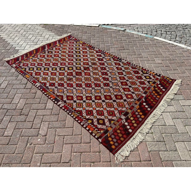 This beautiful, vintage, handwoven kilim is approximately 60 years old. It is handmade of very fine quality wool and...