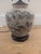 This is an antique lamp that has similarities to a ceramic Chinese ginger jar. The base has a crackle glaze with hand...