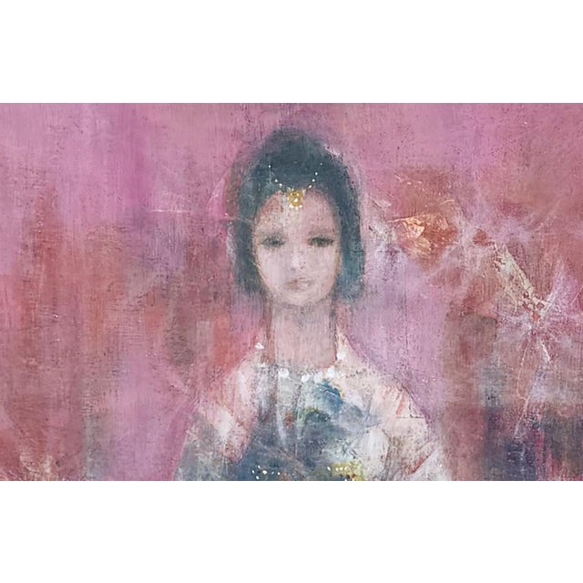 A striking mid century oil on canvas portrait depicting a young Indian girl seated gracefully, adorned with flowers and...
