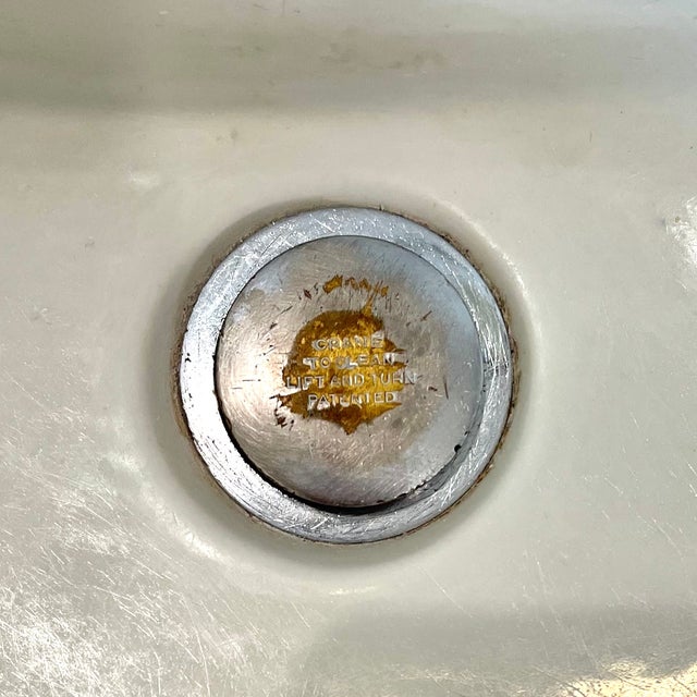 This Antique Crane Pedestal Sink from the 1920s is a stunning piece with a timeless design. Made of white porcelain, this...