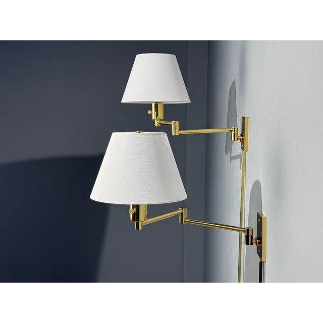 George Hansen, MetalArte, Articulating Wall Lights or Sconces, Polished Brass, Spain, 1970s Pair of model 1706 polished...