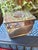 Perfect for the coastal or Palm Beach home, this petite box is silver over copper and has the clam shell motif on the lid....