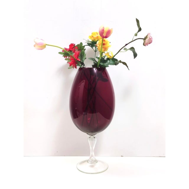 Made in Empoli, Italy, 1960s. This vase is made in crimson and transparent hand-blown glass and has a drinking glass...