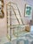 A fabulous 1983 polished brass and glass adjustable two part etagere by Design Institute of America. DIA is renowned for...