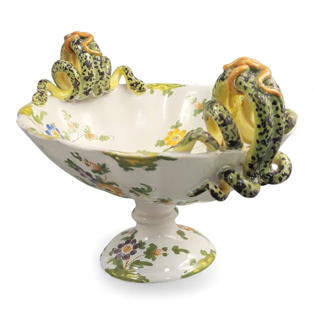 An oval Florentine majolica vase attributed to Ulisse Cantagalli, c.1880. The elongated form stands on a stepped foot and...
