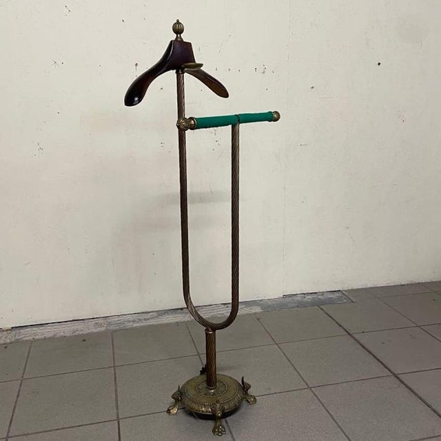 A refined french neoclassical valet stand with hollywood regency accents, dating back to the mid-20th century...