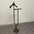 A refined french neoclassical valet stand with hollywood regency accents, dating back to the mid-20th century...