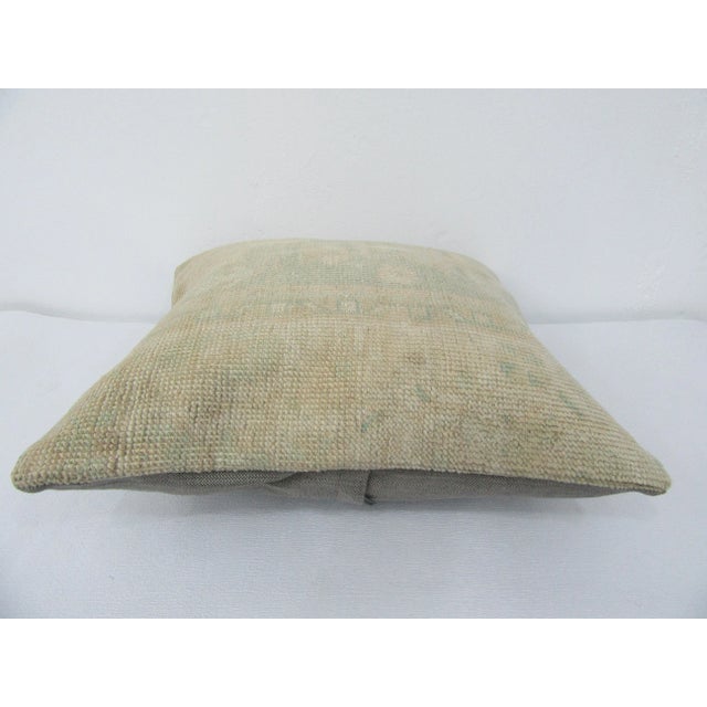 This is a pillow cover made from a vintage kilim rug. The piece was properly washed and ready to use. Pillow inserts not...