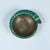 A heavy, cast bronze ashtray by Maurice Ascalon in a nautilus shape has a fluted, flat edge that widens as it spirals...