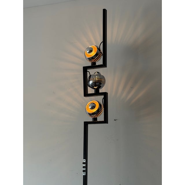 An original Italian floor lamp by Arredoluce, ca' 1960's. Designed by Angelo Lelli. Marble base, shades pivot to aim in...