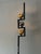 An original Italian floor lamp by Arredoluce, ca' 1960's. Designed by Angelo Lelli. Marble base, shades pivot to aim in...
