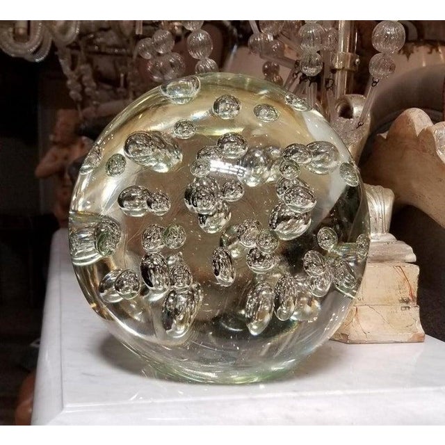 Italian Mid-Century crystal sphere with air bubbles throughout. Flat on bottom to sit on surfaces.