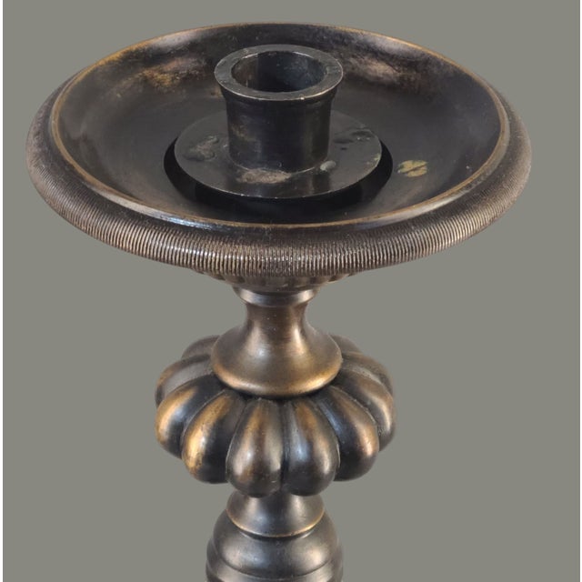 Elevate your home decor with the vintage charm of this ornately designed bronze candle holder. Standing at an impressive...