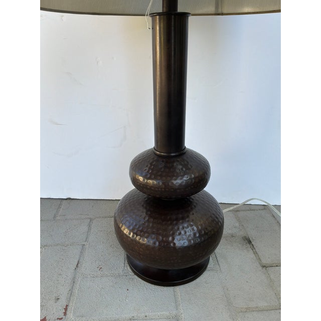 Industrial Currey & Co Hammered Gourd Bronze Lamp. Metal gourd shaped base with a taupe drum shade. Original retail $490....