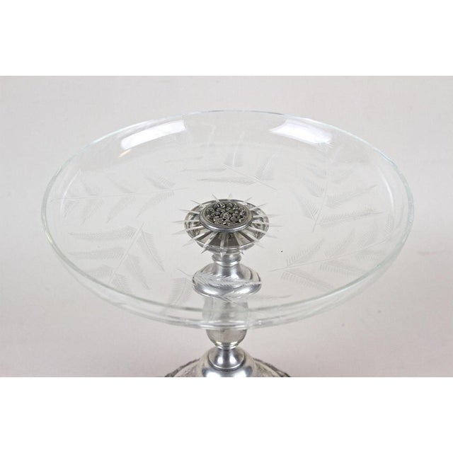 Fantastic Art Nouveau silver centerpiece with glass bowl from the period in Austria around 1895. The artfully shaped base,...