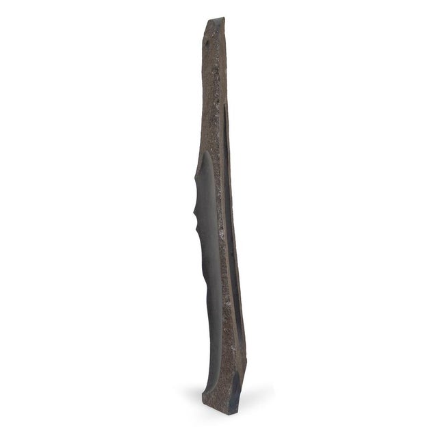 Roland Berger’s Stele III presents an upright, archaic-looking basalt block in which the rough outer skin and a softly...