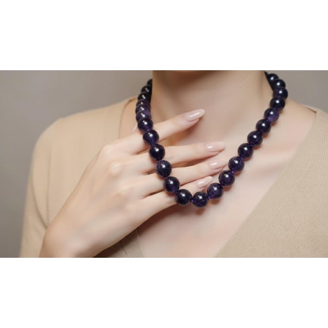 A Statement of Natural Beauty: Substantial Brazilian Amethyst Necklace This magnificent 25-inch (63.5 cm) necklace makes a...