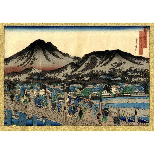 The Sanjo Bridge is an original artwork realized in 1858 by Hasegawa Sadanobu (1809 - 1879). Chuban yokoe. From the series...