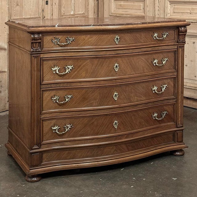 Antique Dutch Neoclassical Marble Top Walnut Chest of Drawers was designed to add stately flair to any room, while...