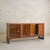 A monumental French rosewood sideboard, dating to the 1940s. Crafted in richly figured rosewood veneers, the façade is...