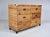 1970's woven rattan footed chest of six drawers in the campaign style with rich honey tones & all original brass hardware....