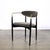 This Mid-Century Modernist Sculptural Chair in Black Enameled Walnut with Brass Arms is created by Kofod-Larsen and...