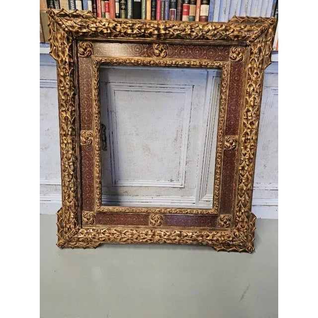 Elegant and decorative pair of 19th-century frames crafted in carved and painted wood, inspired by Renaissance aesthetics....