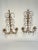 A fabulous pair of Italian Gilded Tole Two-Arm Candle Sconces with 33 eye catching crystal prisms on each sconce. Circa...