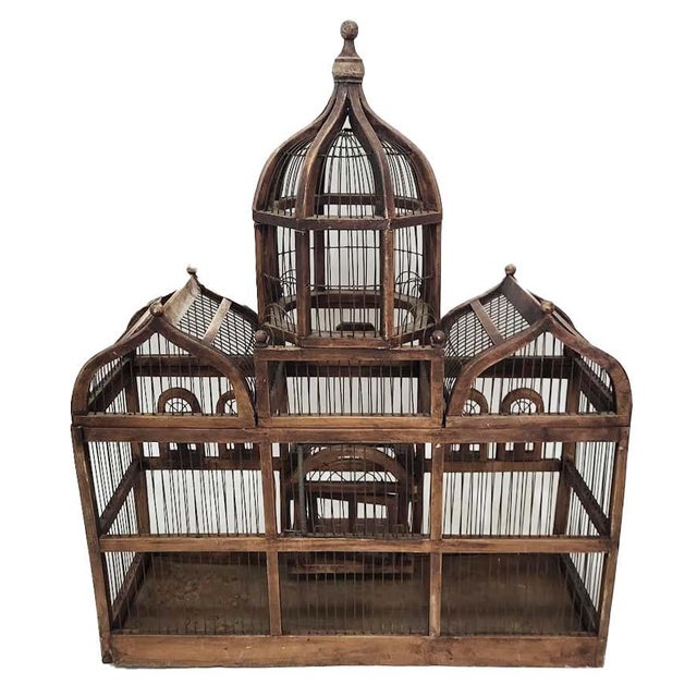 A magnificent antique architectural birdcage crafted in a classic French Victorian pavilion style. This monumental...