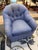 This is a club chair. It also is able to swivel. It is made by Kravet furniture. It has a woven linen fabric in a blue...