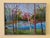 Trees on a lake in the Spring signed by the artist.