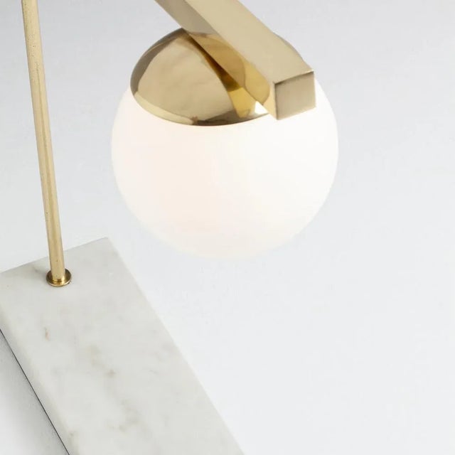 This Globe table lamp comes in multiple configurations and finishes. It is available in lacquered, polished, or brushed...