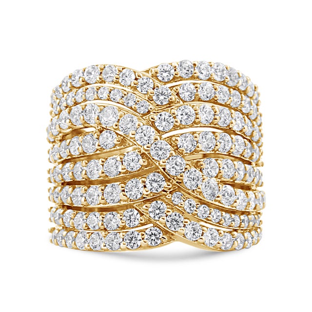 Multi rows of round, prong-set diamonds in a bypass motif create this exquisitely designed ring of gleaming 10k yellow...