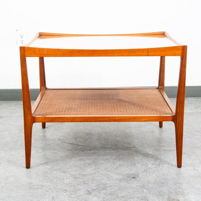 Square walnut coffee table by Heritage Henredon as well as a shelf beneath.