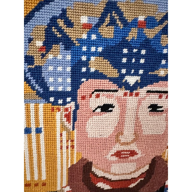 Very unique vintage needlepoint mounted on wood panel of Asian Woman framed in a black faux bamboo type frame. It has kind...