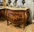 Make a statement with this magnificent French bombe commode, showcasing exceptional floral marquetry, graceful serpentine...