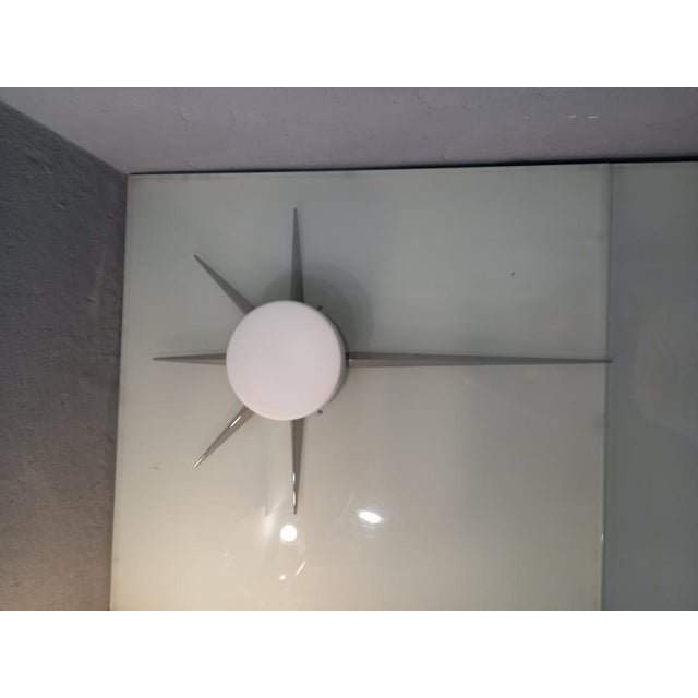 Stella Cometa Wall Sconce in Chrome in the style of Gio Ponti, in Flawless conditions. Designed 1980 to 1989 I have...