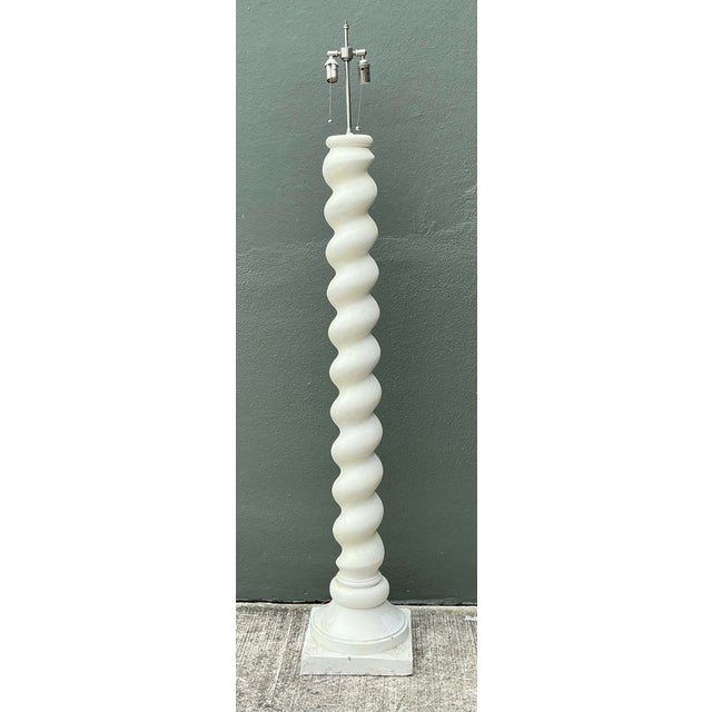 Elevate your interior with the iconic "California Cool" aesthetic embodied in this monumental white barley twist floor...