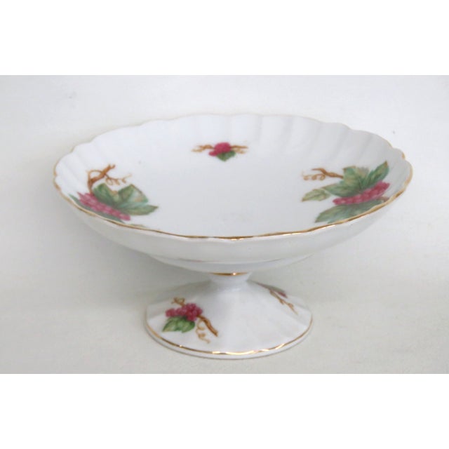 This exquisite Pedestal Dish is made of porcelain. This lovely dish is labeled on the bottom with the following...