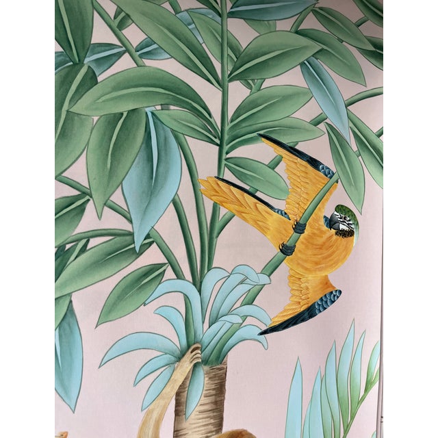 Artisan hand-painted chinoiserie mural set with soft blush pink background, beautifully detailed with tropical palm...