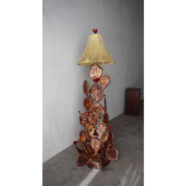 Excellent desert cactus floor lamp, handmade of copper and brass. Includes the original hide shades. Lamp is in excellent,...