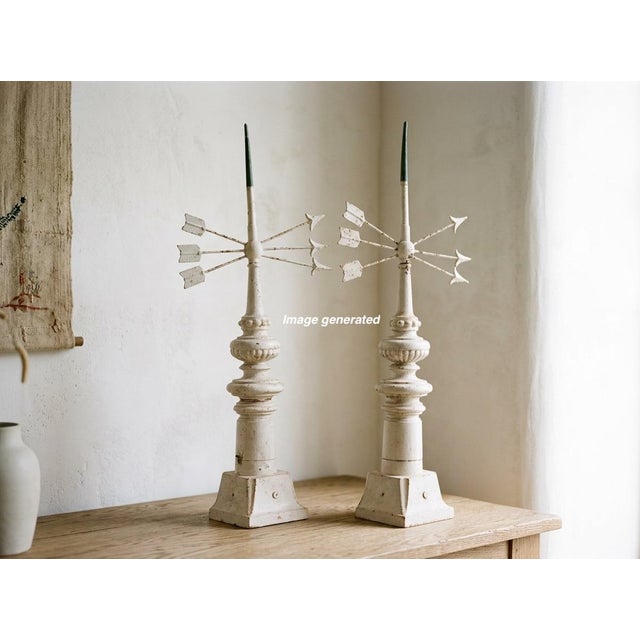 A pair of 19th Century French cast iron weather vane with triple arrows and copper sheathed tip. White painted patina with...