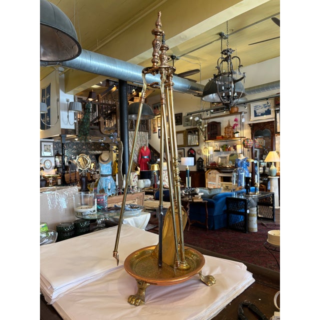 Heavy and well made fireplace tool set with hammered copper catch plate, brass tools, ornate finials handles. 4 pieces...