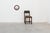 A distinctive Belgian round wall mirror manufactured by Deknudt during the 1960s. The mirror is framed by a warm-toned...