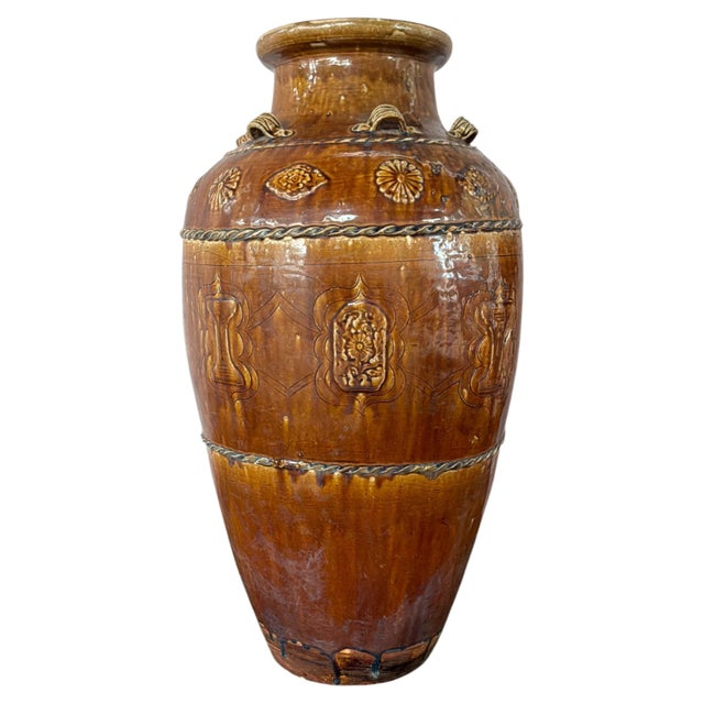Qing Dynasty Martaban-type Glazed Earthenware Storage Jar, circa 1880-1920. This vessel has a tall, gently tapering body...