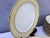 A refined vintage porcelain dining service produced by L'Amandinoise, France, featuring the sought-after 9727 pattern....