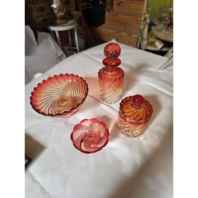 Nice collection of four Rose color Baccarat Accessories.