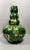 Particular vase in green enameled terracotta with refined floral decorations in pure gold; the decorations are developed...