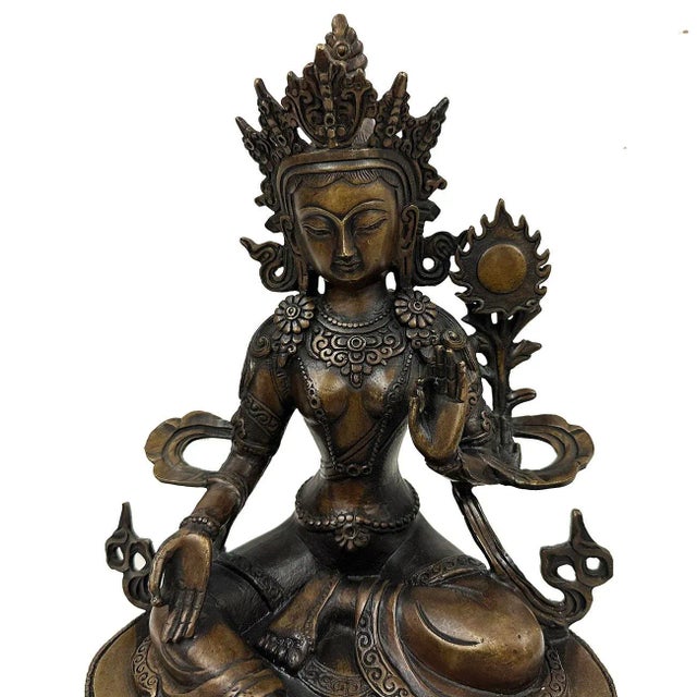 Featured a beautiful bronze sculpture of Tibetan Tara. This Tara is decorated with flowers, lariats, ankle bracelets. She...